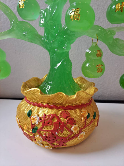 Close-up of jade green gourd tree base with gold decorative pot and red 招财进宝 inscription on CX622