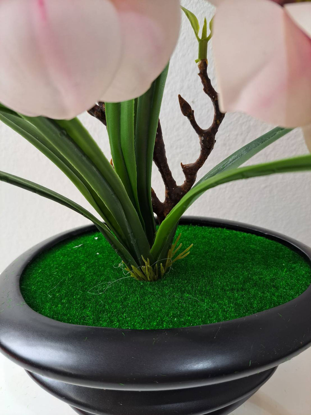 FT-257-B blush pink magnolia base with green grass and dark round ribbed pot