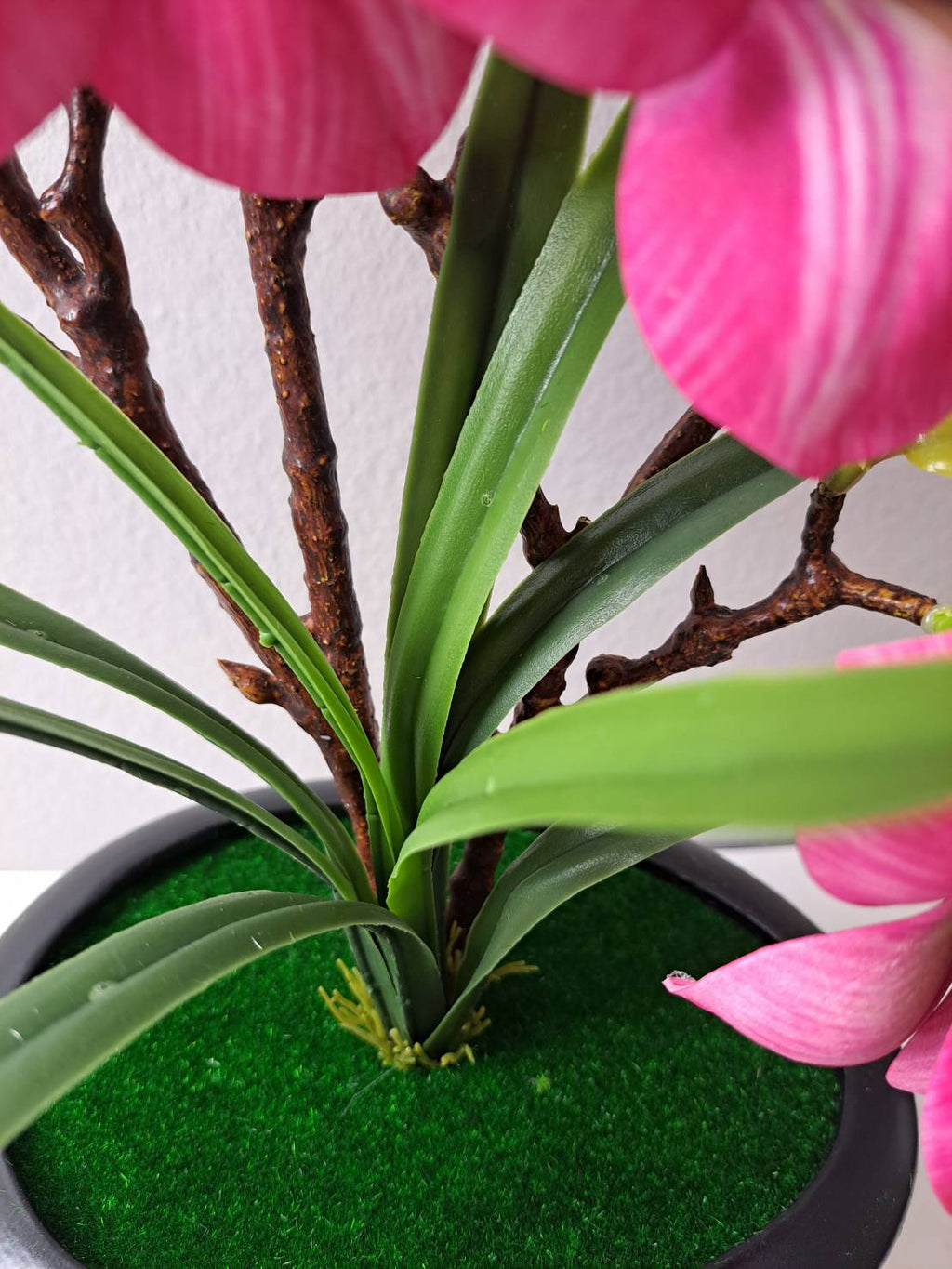 FT-257-C hot pink magnolia base with green grass and dark round ribbed pot