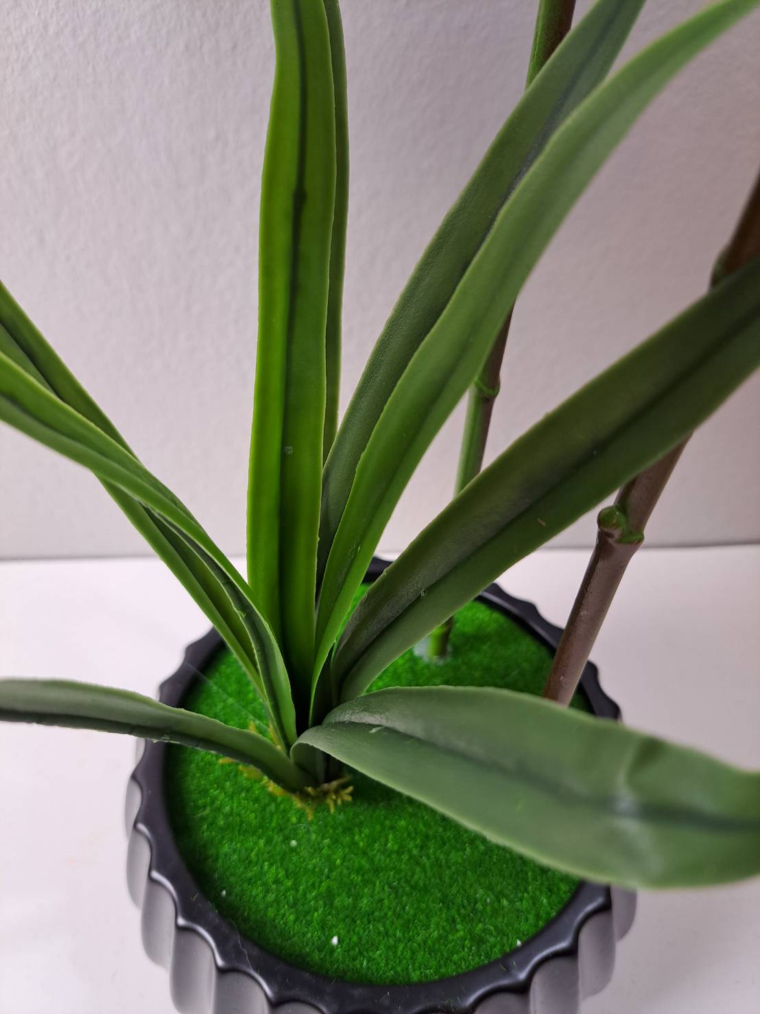 FT-253-D faux orchid base with green leaves and stems in ribbed black pot