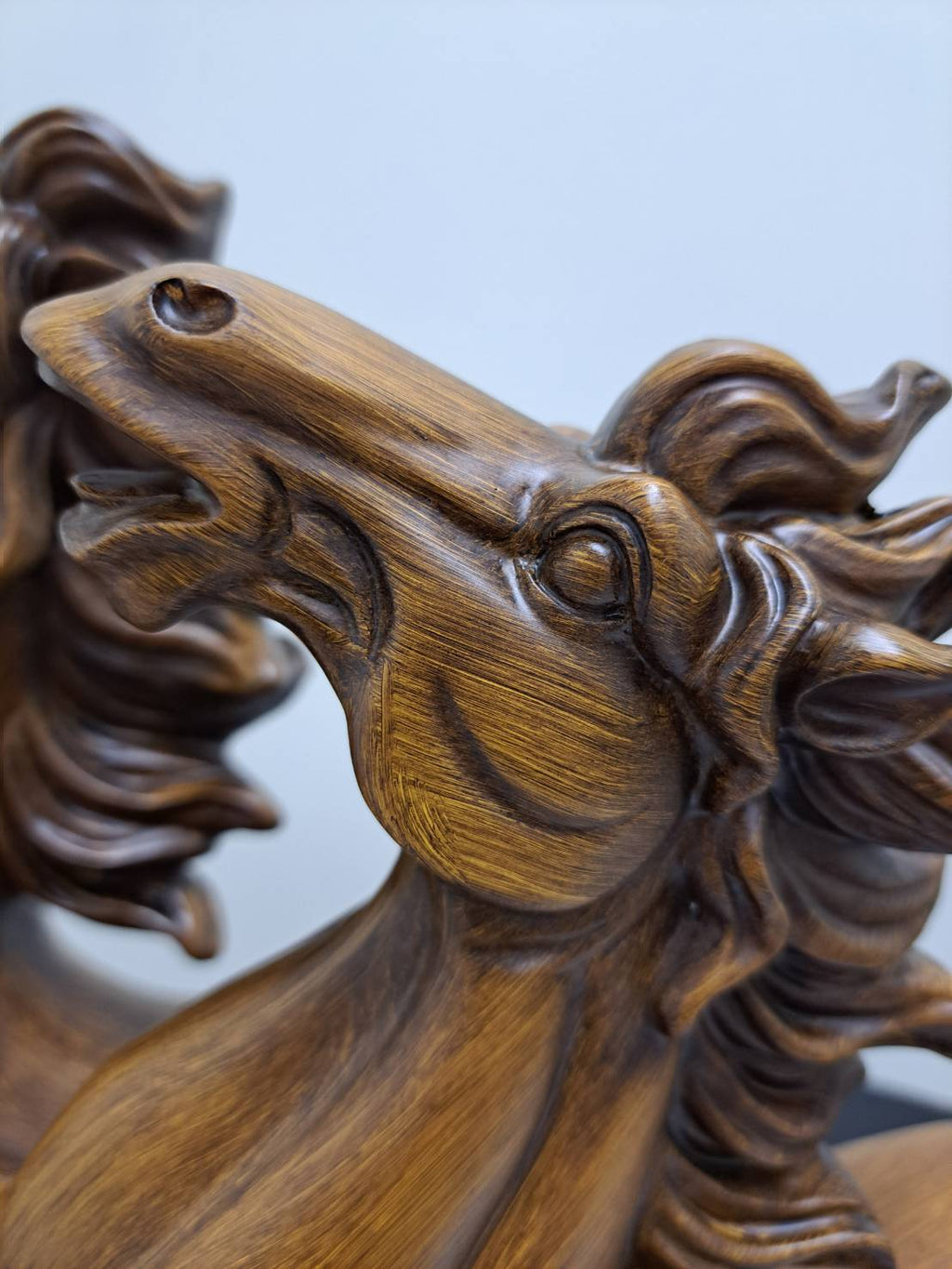 Close-up of flowing mane and cloud scroll base detail with gold highlights on horse statue 6944-1