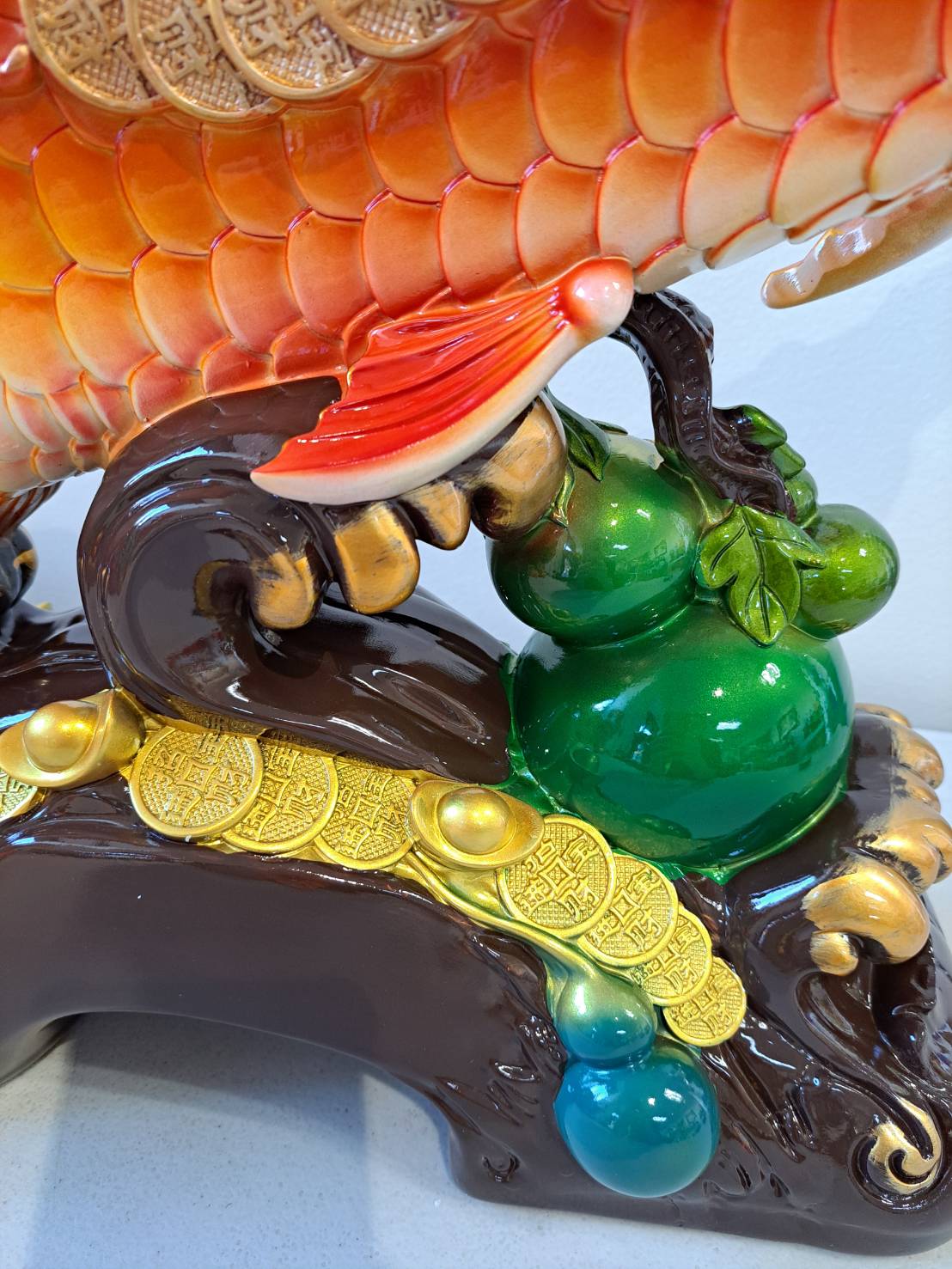 Tail and back fin detail of JF7322-2 red arowana fish statue with orange gradient scales