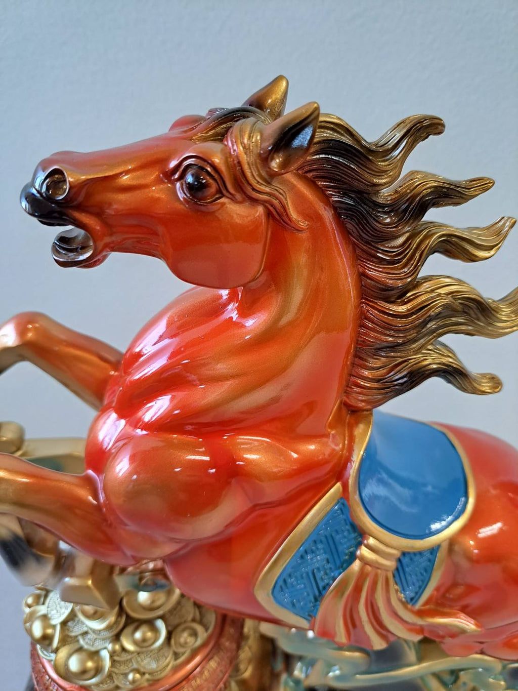 Side profile of rearing horse statue 7358-1 showing full body with blue gemstone saddle and gold coin base
