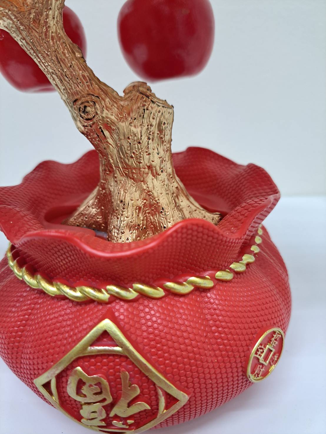 Back view of ornamental red pot base on Artificial Apple Tree N19