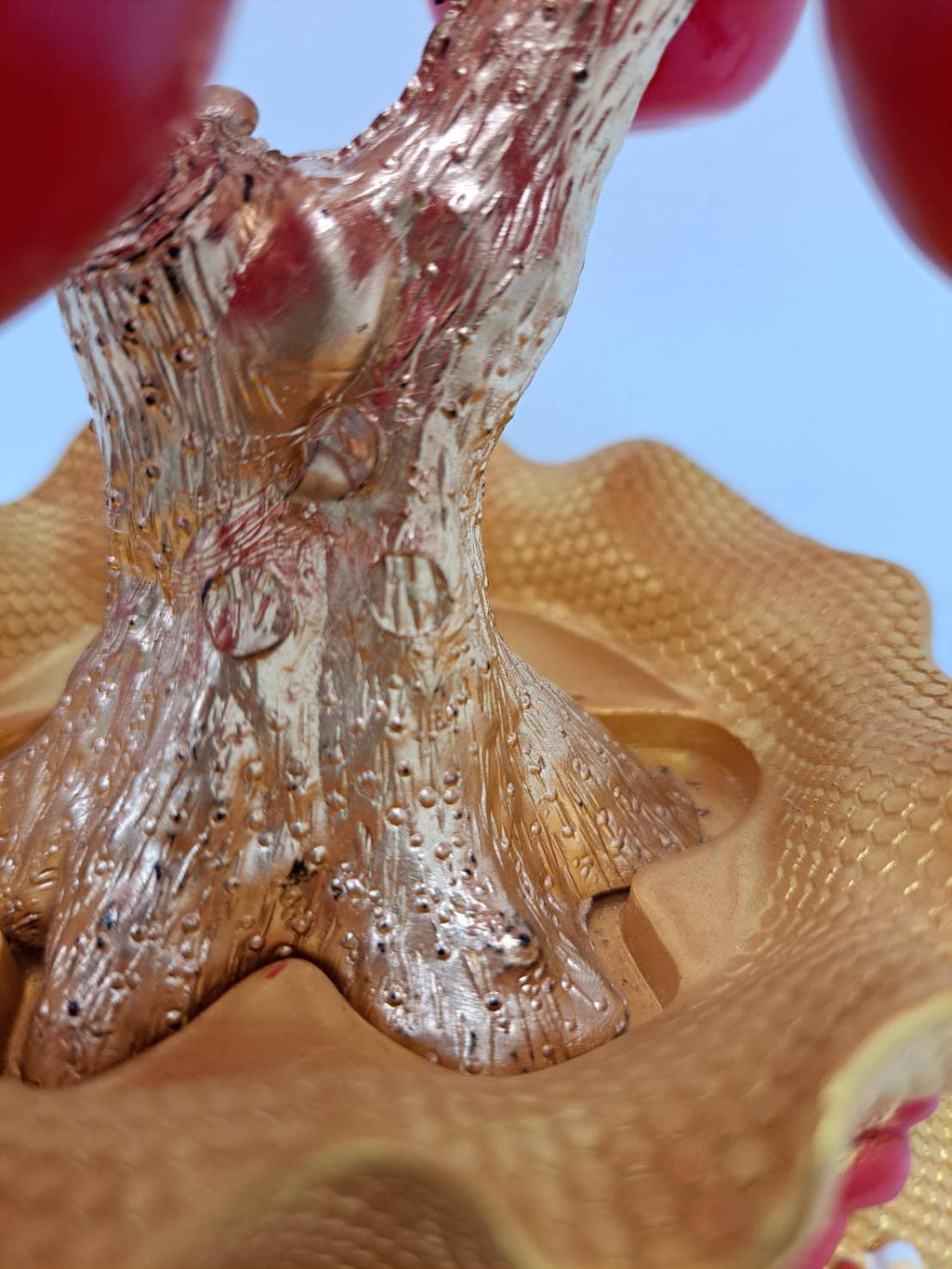 Detail of red rope trim and blossom motifs on golden pot of Artificial Apple Tree N20