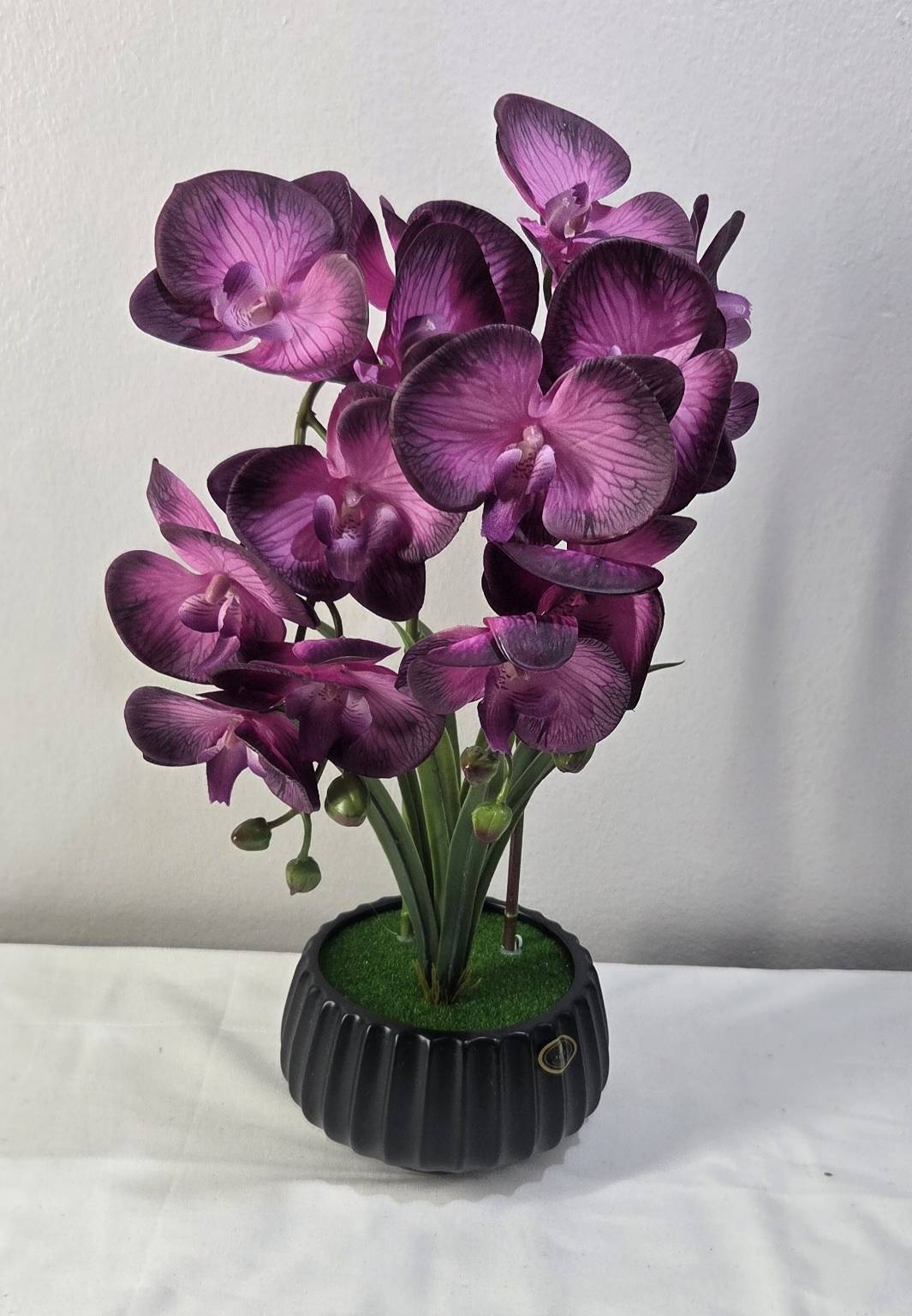 FT-253-E faux magenta-purple orchid arrangement in black ribbed pot