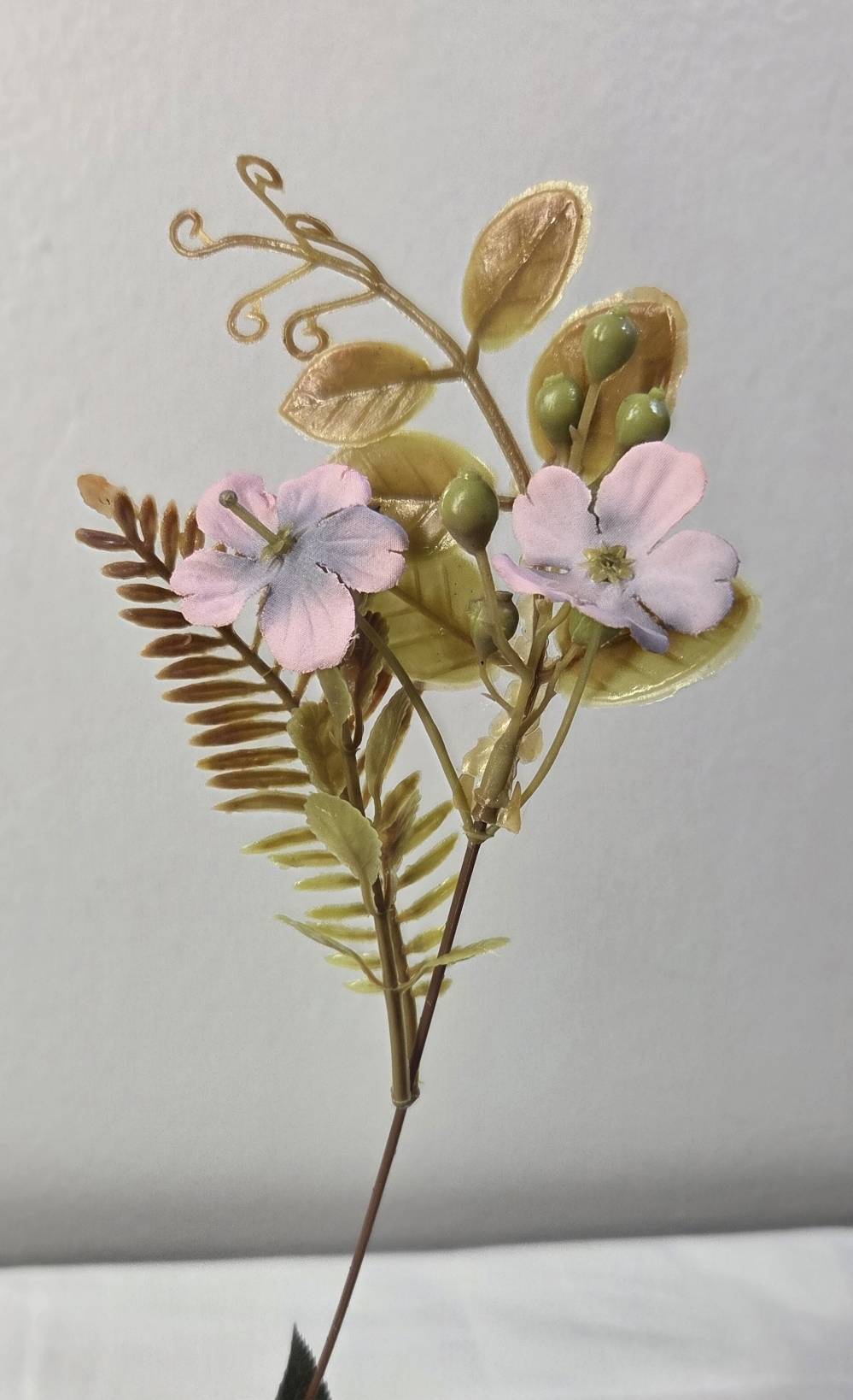 Faux accent stem with blush wildflowers, olive green fern leaves, green berry clusters and golden curling tendrils