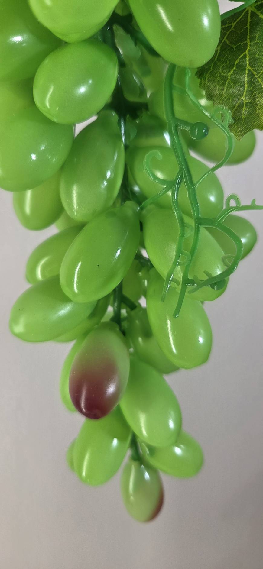 Faux Green Grape Cluster GRT-02 detail - lifelike green grapes with natural color variation and burgundy accent grapes, green tendril stems
