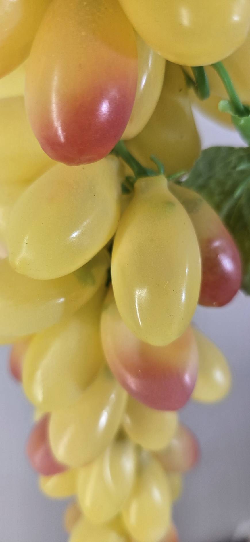 Faux Yellow Grape Cluster GRT-03 detail - lifelike yellow grapes with natural pink-red color gradient tips and green curling tendrils