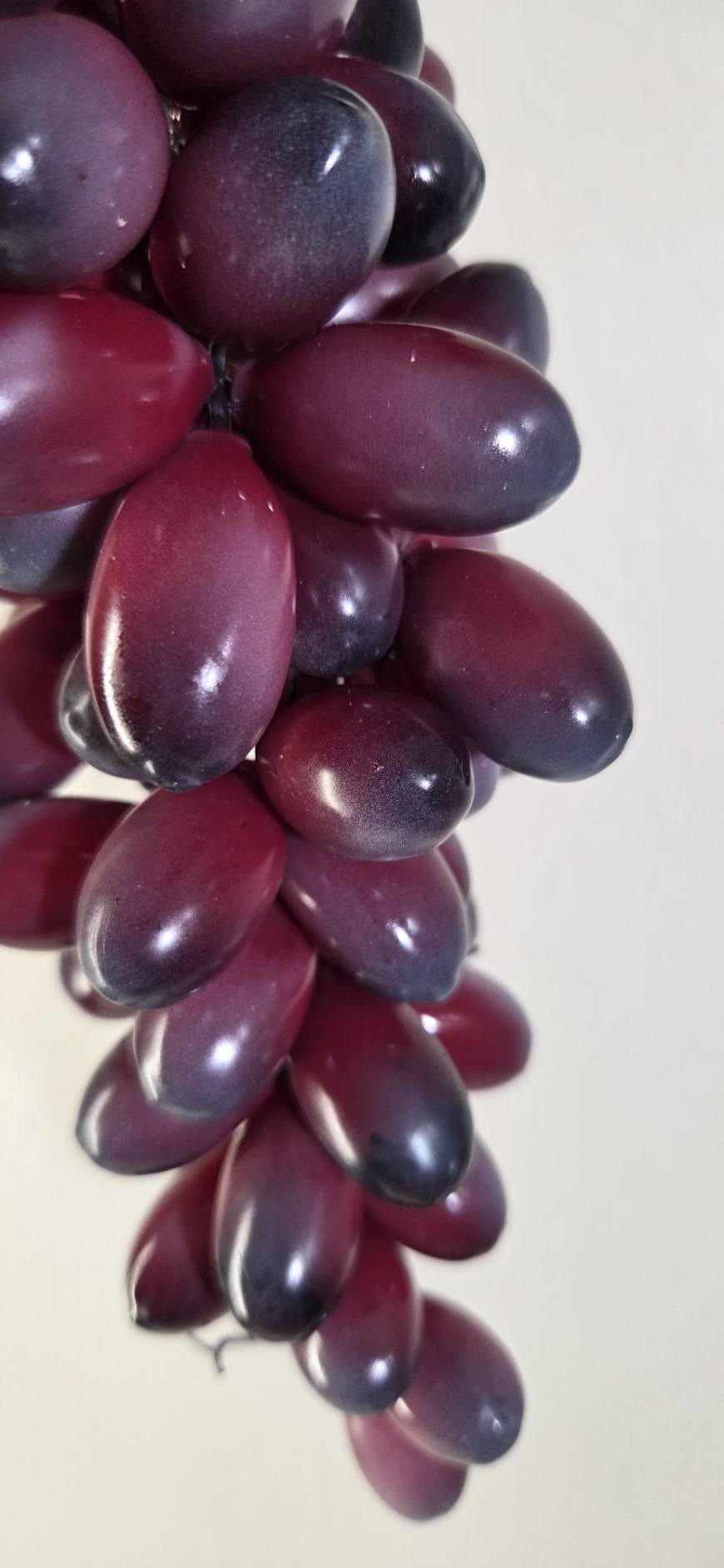 Faux Dark Purple Grape Cluster GRT-04 close-up - glossy deep burgundy and dark purple oval grapes with rich color gradient