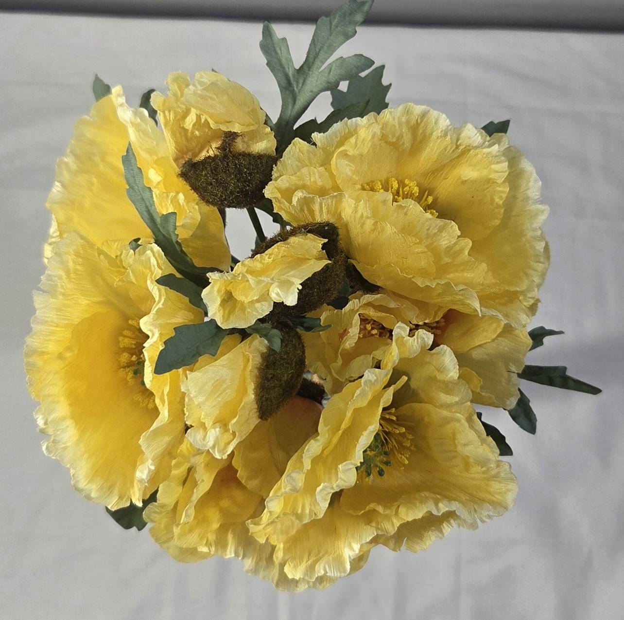 Top view of faux yellow poppy bouquet PPY-03 showing full bloom arrangement with sage-green foliage