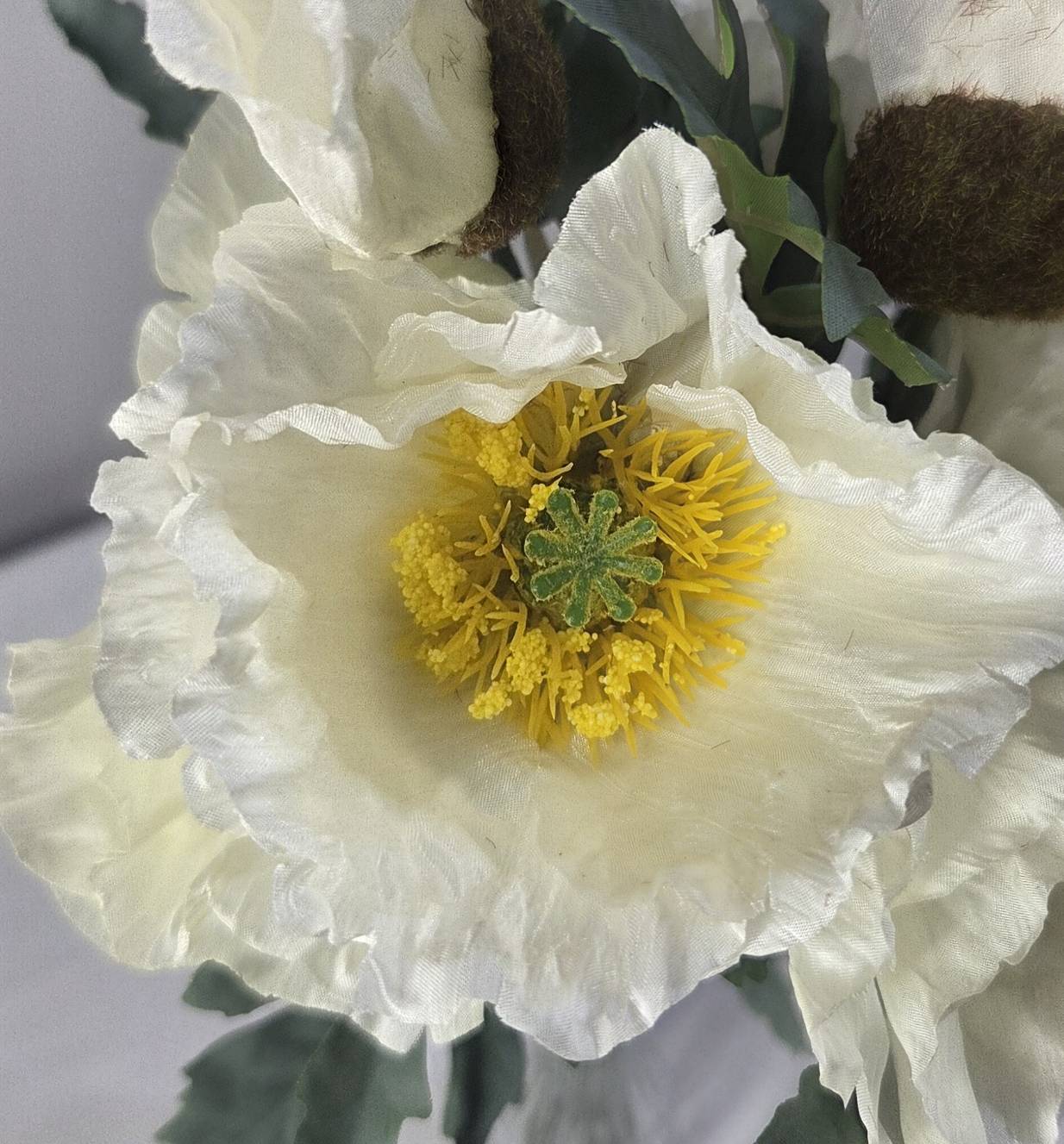 Close-up of faux white poppy bloom with golden yellow stamens and ruffled petals - PPY-04