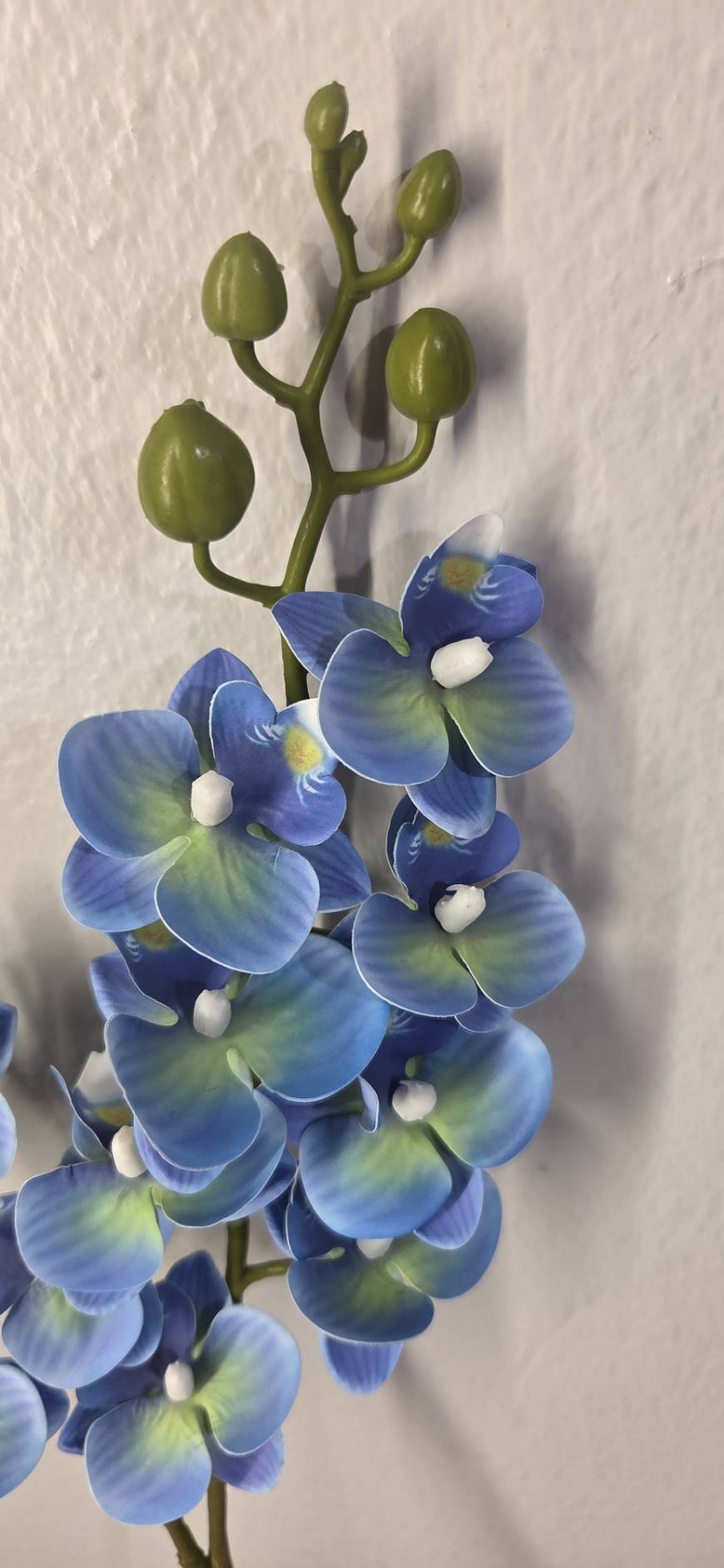 Faux Blue Phalaenopsis Orchid Stem OCT-03 - close-up of cobalt blue orchid blooms with green buds