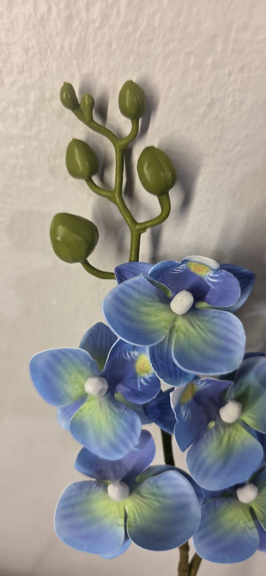 Faux Blue Phalaenopsis Orchid Stem OCT-03 - detail of blue petals with yellow-green centers and olive buds