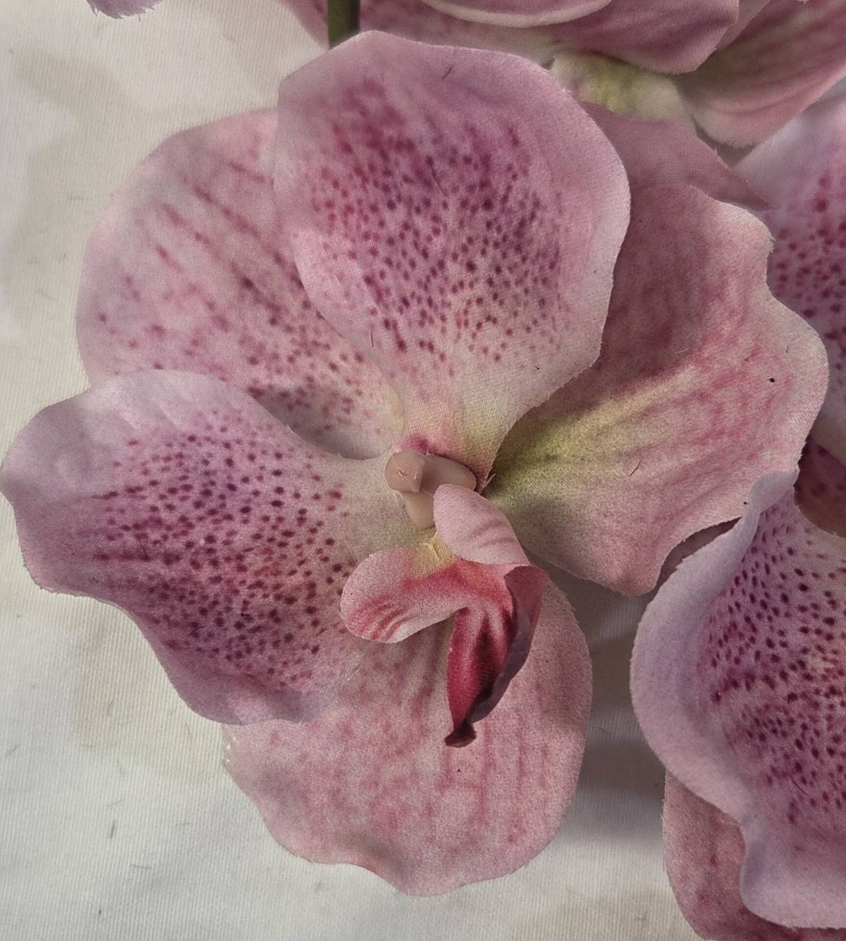 Faux Pink Vanda Orchid Stem ORS-02 - close-up of single pink vanda orchid bloom with intricate center detail