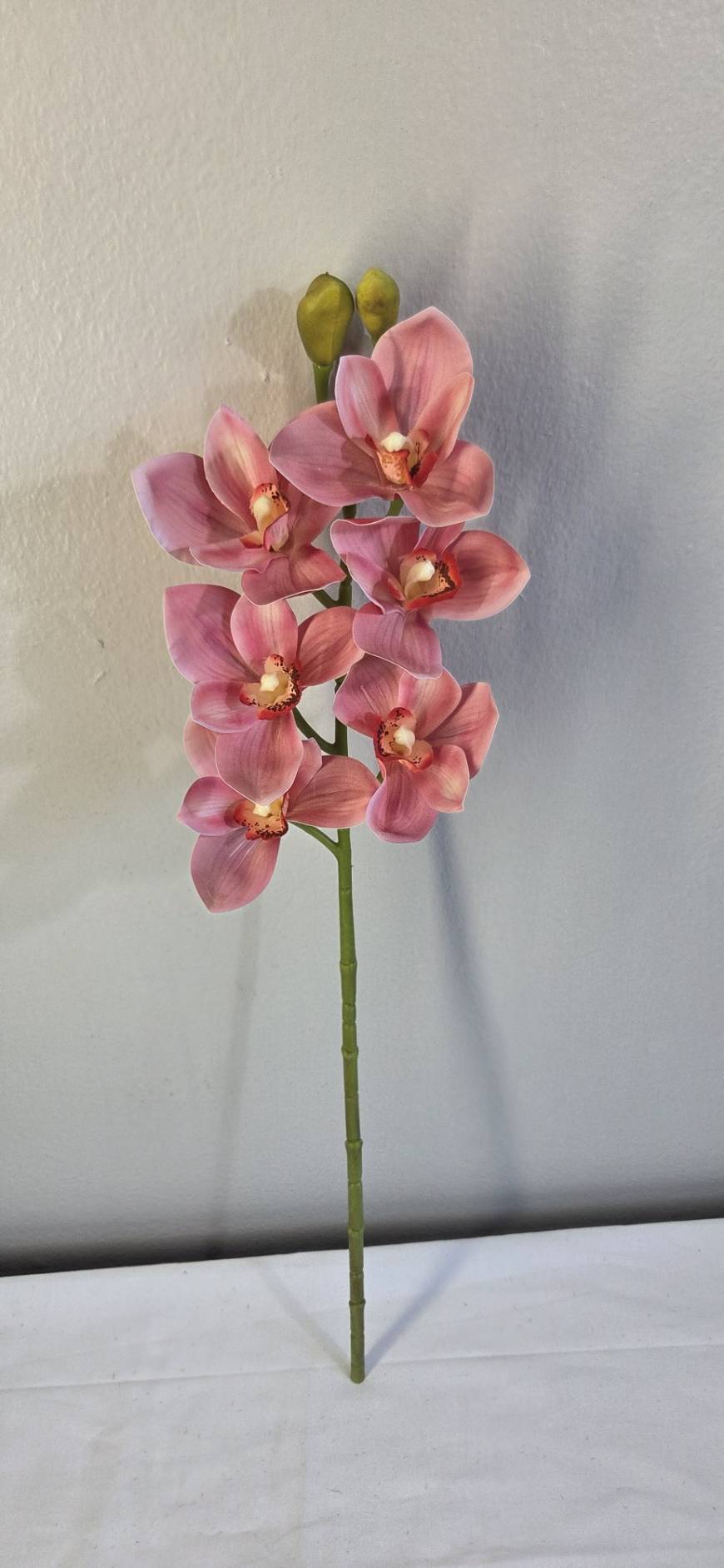 Faux Pink Cymbidium Orchid Stem ORA-03 - full stem view against neutral background