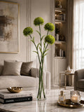 Faux green thistle stems in glass vase luxury living room decor