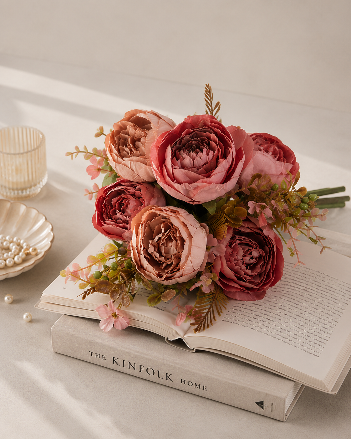 Faux Peony Rose Bouquet ROS-02 lifestyle - dusty rose peony bouquet arranged on open book with pearl accents