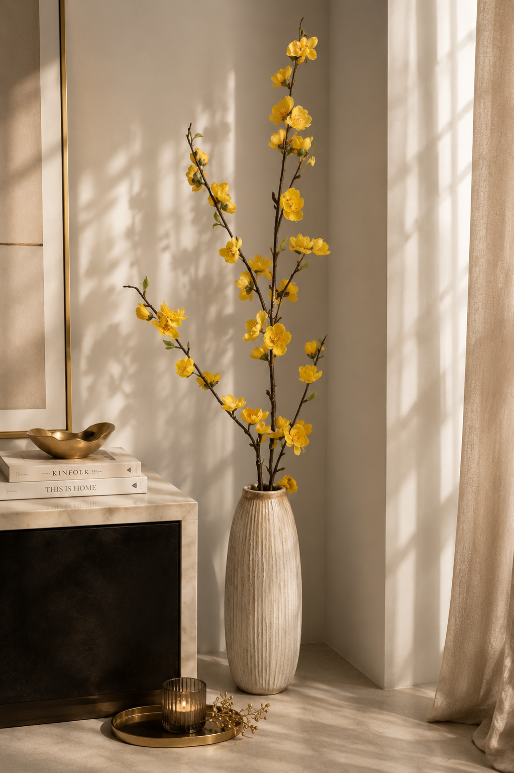 Yellow peach blossom branches in tall white vase - living room lifestyle