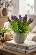 Faux lavender plant lifestyle on coffee table with candle and books