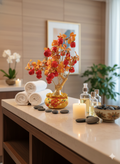 Artificial Red Apple Tree N28 Golden displayed on spa reception counter with candles and white orchids in luxury interior